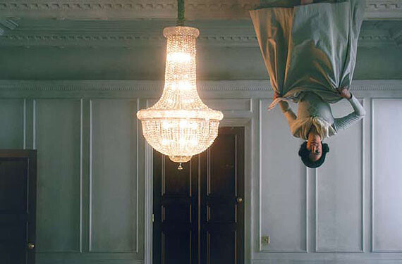 Matthew Buckingham, Still from The Spirit and the Letter, 2007. Continuous video projection with sound, electrified chandelier, mirror., https://photography-now.com/exhibition/81160